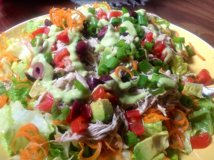 Vibrant salad with avocado dressing.