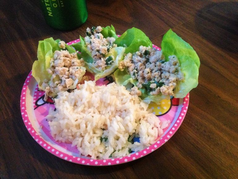 Chicken larb in butter lettuce cups with rice.