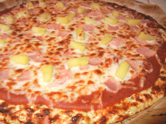 A ham and pineapple gluten-free pizza with cauliflower crust.