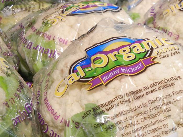 A close-up of packaged organic cauliflower in the store